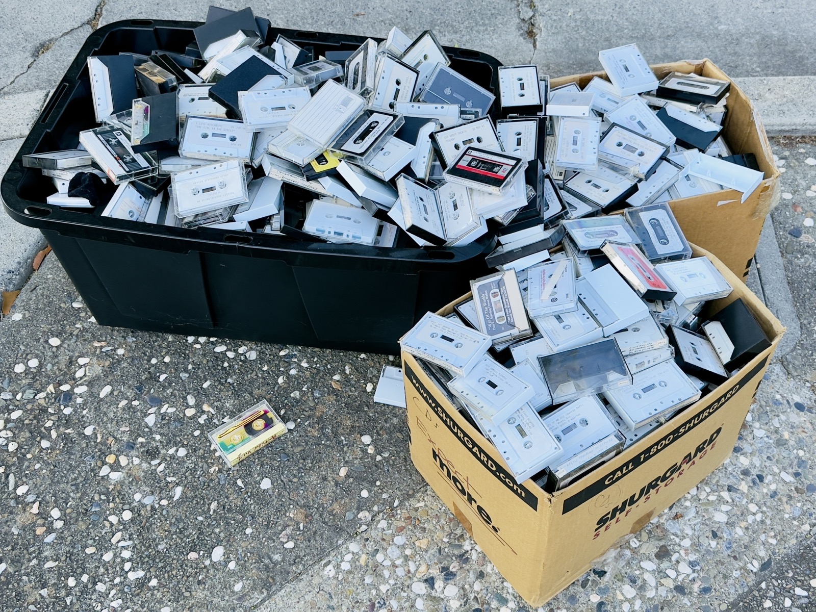 Three boxes of tapes on the sidewalk